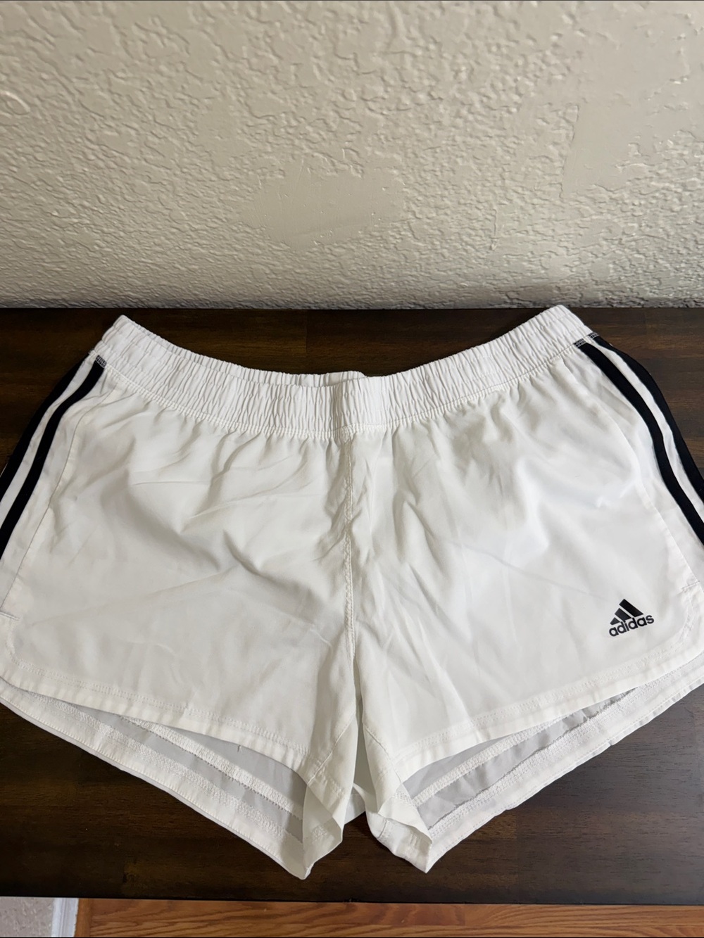 adidas White Women's Athletic Shorts with Black Side Stripes and Logo